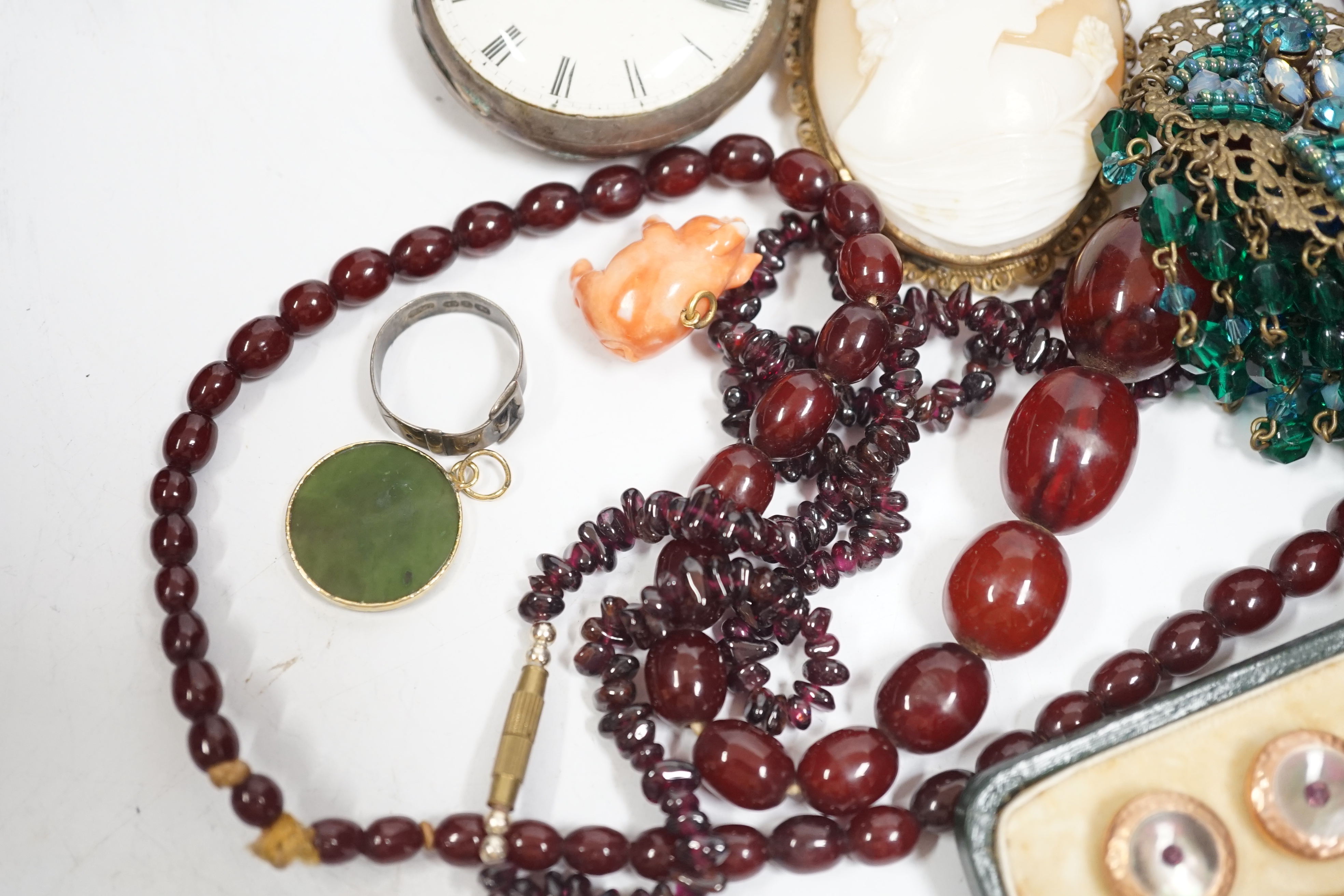 A group of assorted costume and other jewellery including a simulated cherry amber necklace, 52cm, gross weight 33 grams, a gilt metal and mother of pearl dress stud set, pair of Ruskin ceramic cufflinks, A Victorian sil